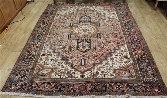 A Heriz brown ground rug, 280 x 215cm